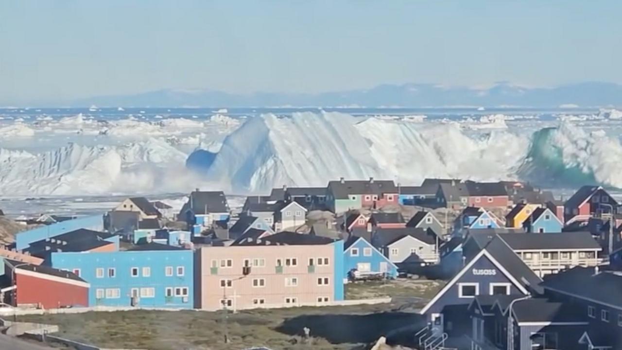 Watch: Giant iceberg turns over near Greenland's coast