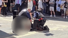 Woman arrested after four stabbed in central London